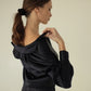 Video review Silk pajama shirt with collar and stylish cut-out details front and back. Deep V-neck cut.Straight fit model with long sleeves and buttons on the front, basic silk shirt, шовкова сорочка з вирізами на куравах, базова сорочка чорна, сорочка віскоза купити, чорна сорочка з V вирізом, довга шовкова сорочка на гудзики МОЛОДО MOLODO loungewear, відео огляд одяг для сну MOLODO