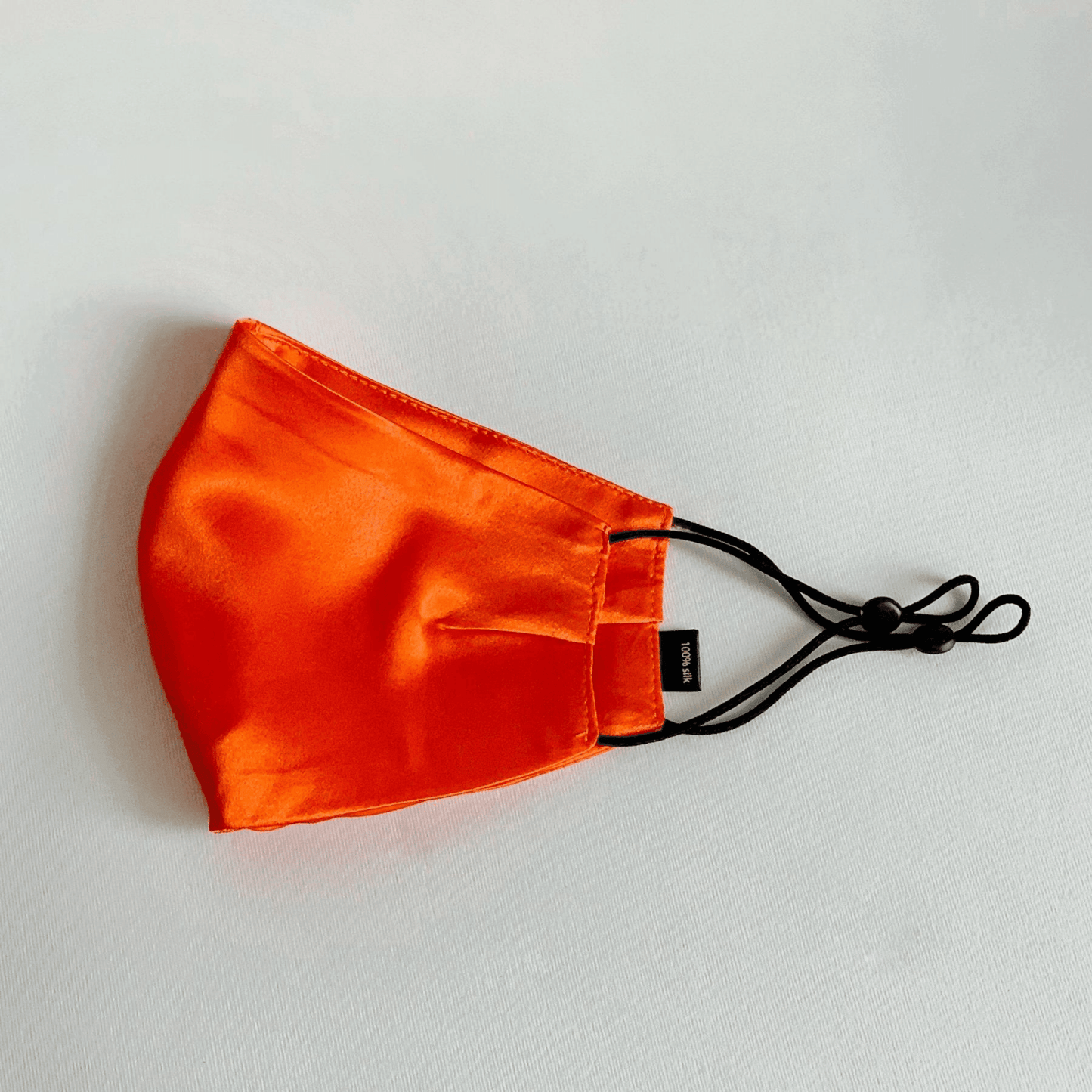 помаранчева шовкова захисна маска з натурального шовку MOLODO з регуляторами довжини резинок